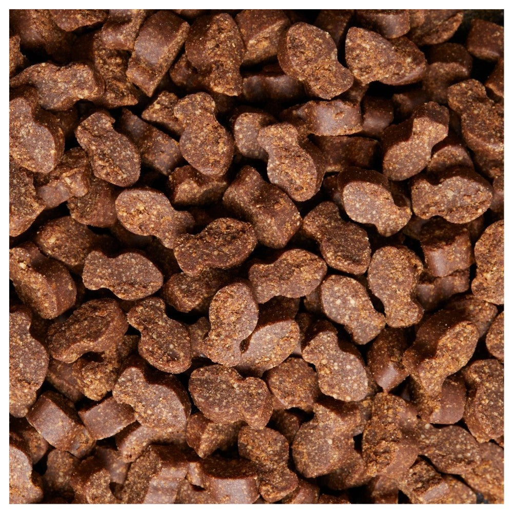 Primer plano de bocados masticables Daily Probiotic de Pet Naturals para gatos, mostrando su textura y forma de pez pequeño